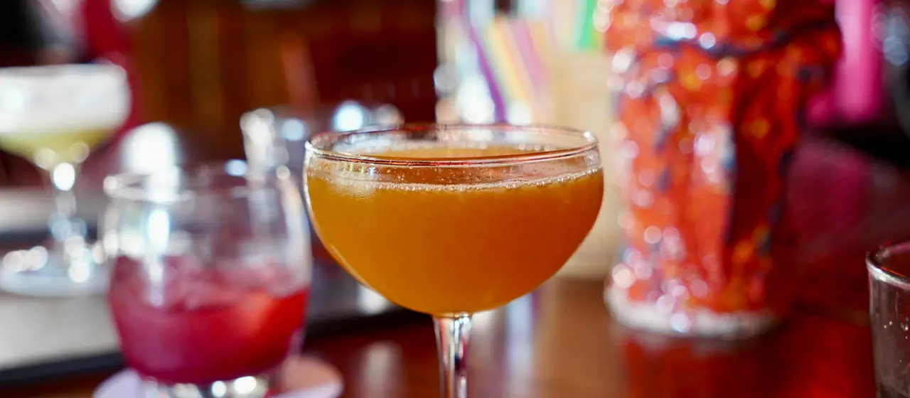 Cocktails with lime and mint on a bar counter