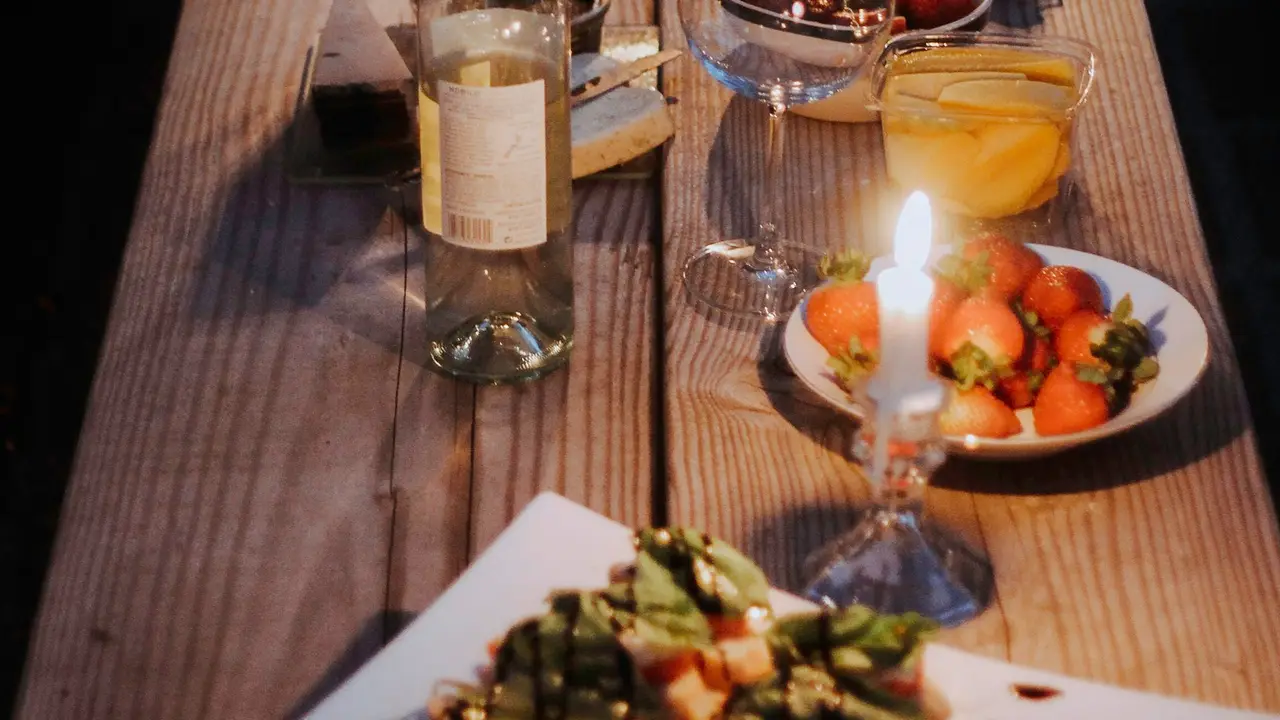 A table laid for dinner beside the river