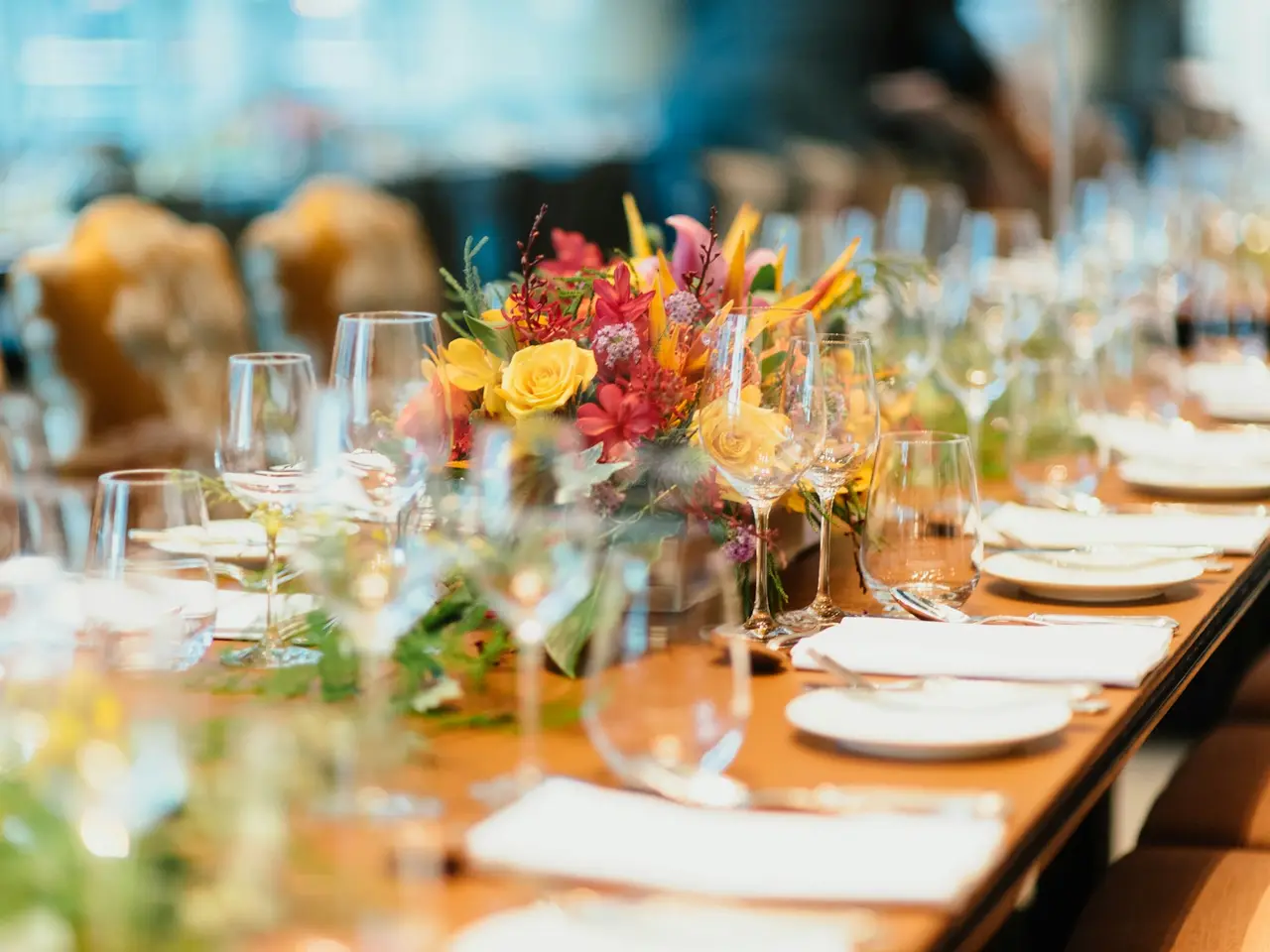Glasses and flowers on a table set for a celebration
