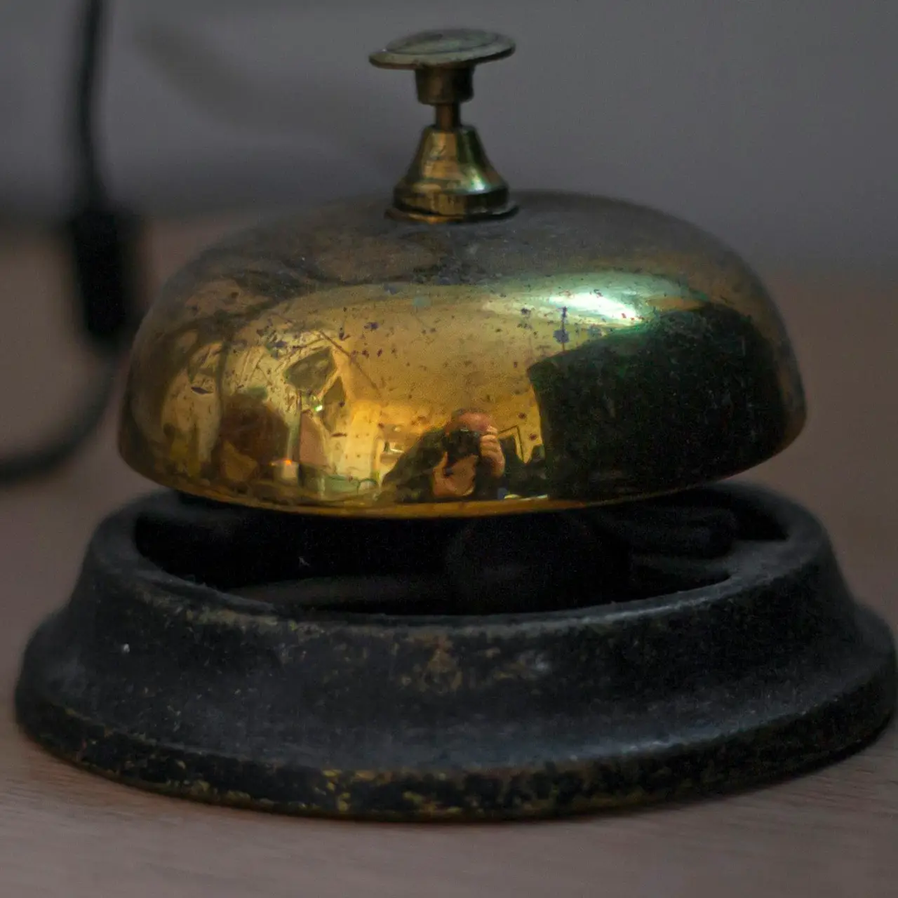 Brass service bell on the concierge desk