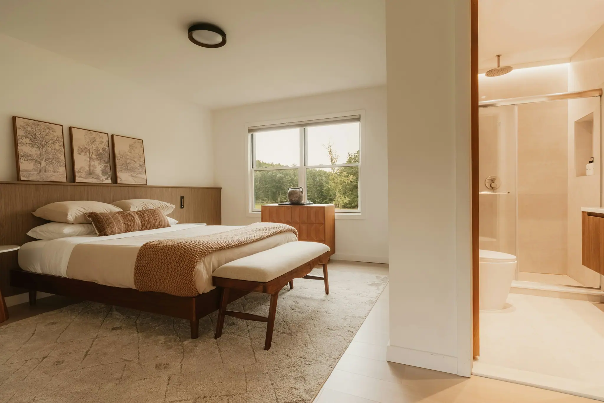 The Deluxe King: a king bed on a walnut frame against an oak headboard wall
